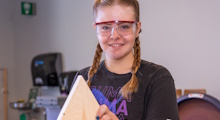 Student building a bird house