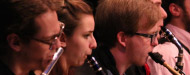 Students playing wind instruments at a concert