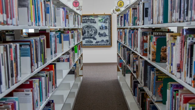 Shelves of books in CCC's library at the Dye Learning Center on the Oregon City campus